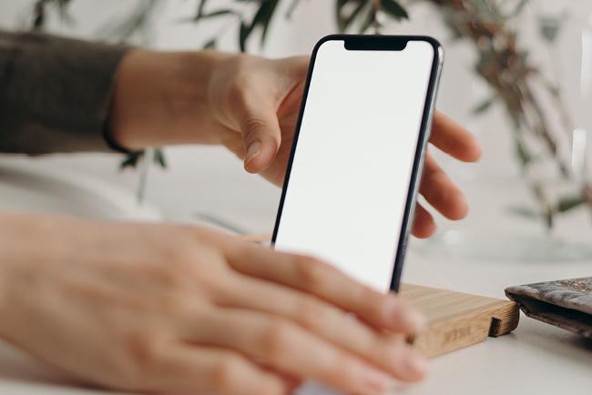 hands holding iPhone 11